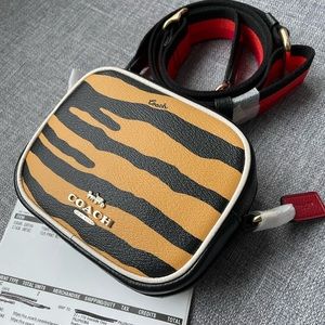 Coach Dempsey mini camera bag with tiger print